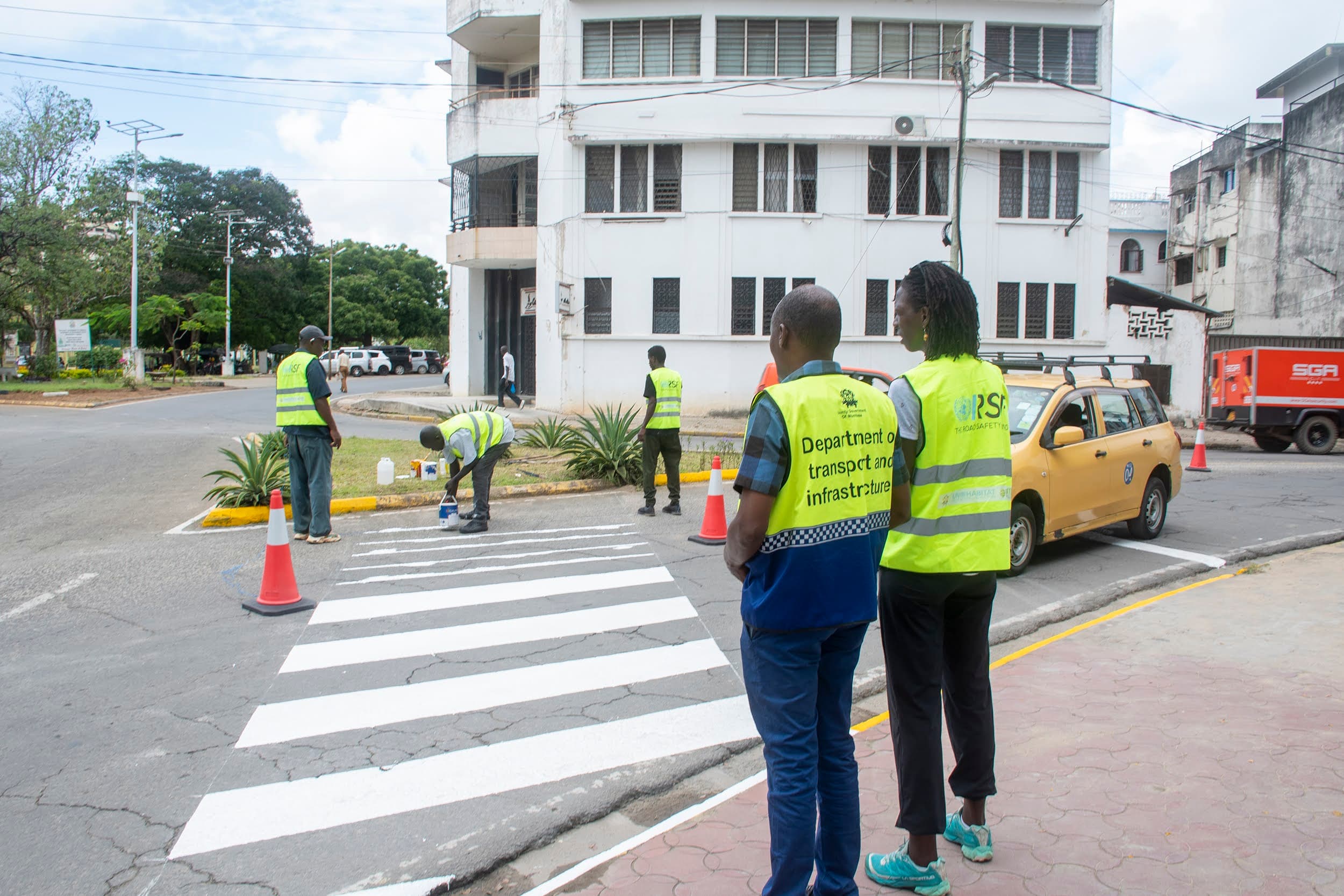 ARUSi partners marking a pedestrian crossing during a Mombasa road-safety intervention.
